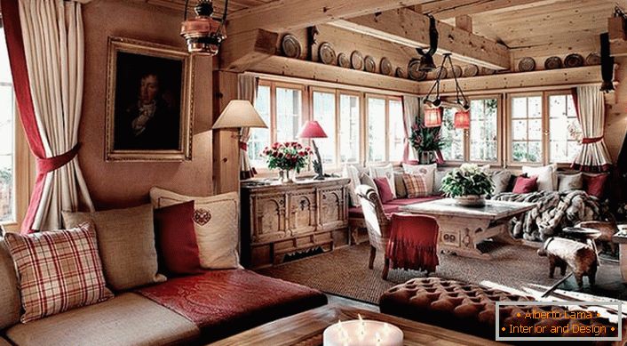 Akcenty červenej farby v izbe v štýle chaty robia izbu romantickou a esteticky atraktívnou. 