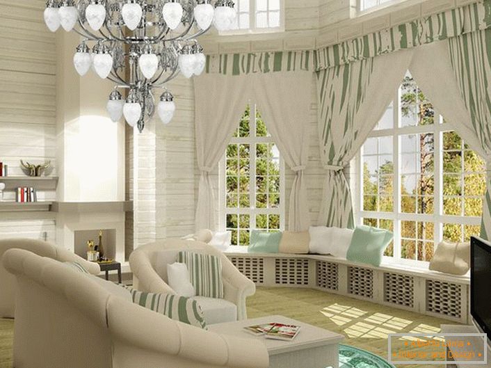 Svetlý obývacia izba v neoklasickom štýle. Útulný a zároveň funkčný priestor. Obzvlášť zaujímavé sú široké parapety zdobené vankúšmi.