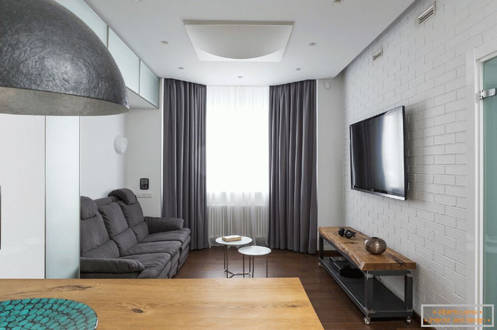 Obývacia izba v apartmáne s riadeným osvetlením
