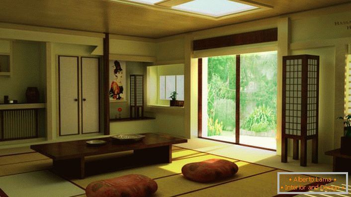 O prítomnosti japonského minimalizmu v obývacej izbe v dedine sa hovorí o správnom nábytku. Nízky stôl je ideálny pre domáce čajové pitie. 