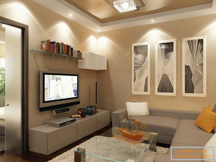 Napínacie stropy béžovej a bielej farby vyzerajú nádherne v modernej obývacej izbe.