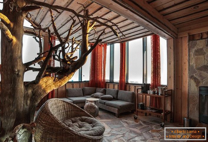 Obývacia izba v štýle krajiny. Klasický štýl: kameň a ľahké drevo.