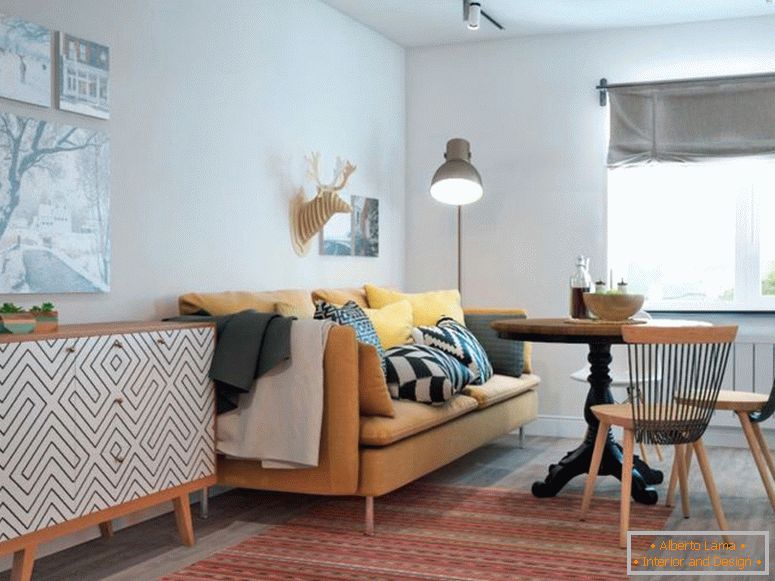 obývacia izba v bielej farbe s pohovkou a okrúhlym stolom