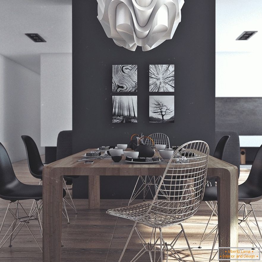 Drevený jedálenský stôl, čierne stoličky a originálne maľby na čiernej stene